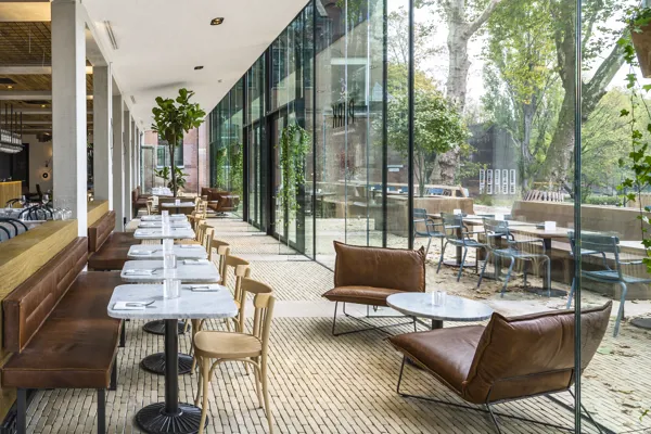 Bronze Yellow Ancienne Belgique forms link between transparent pavilions and terrace