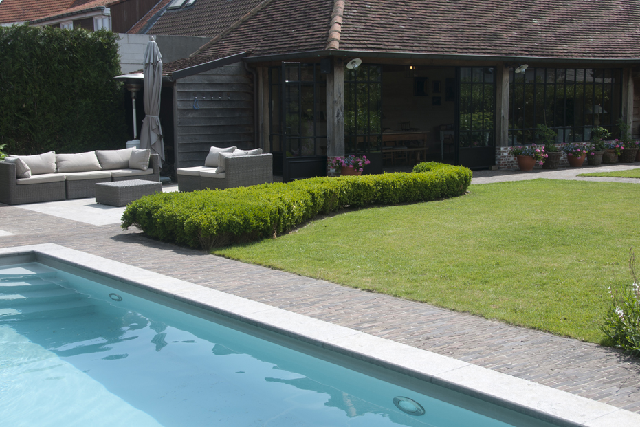 Authentic clay pavers provide a seamless transition between the interior and the exterior