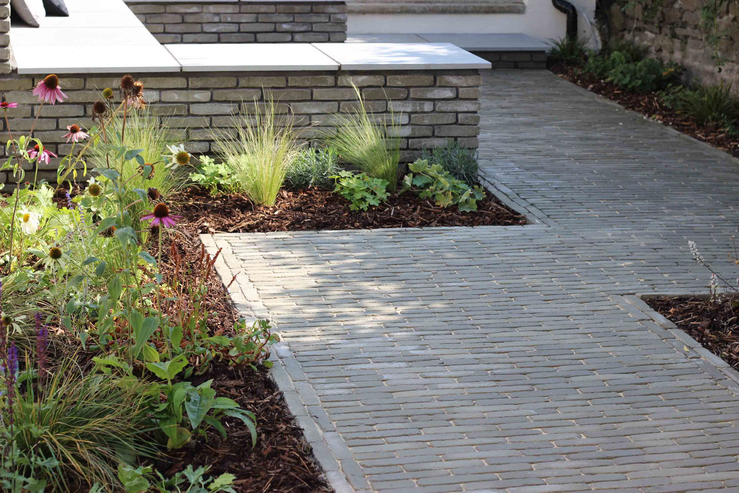 back garden with a subtle mix of traditional materials 